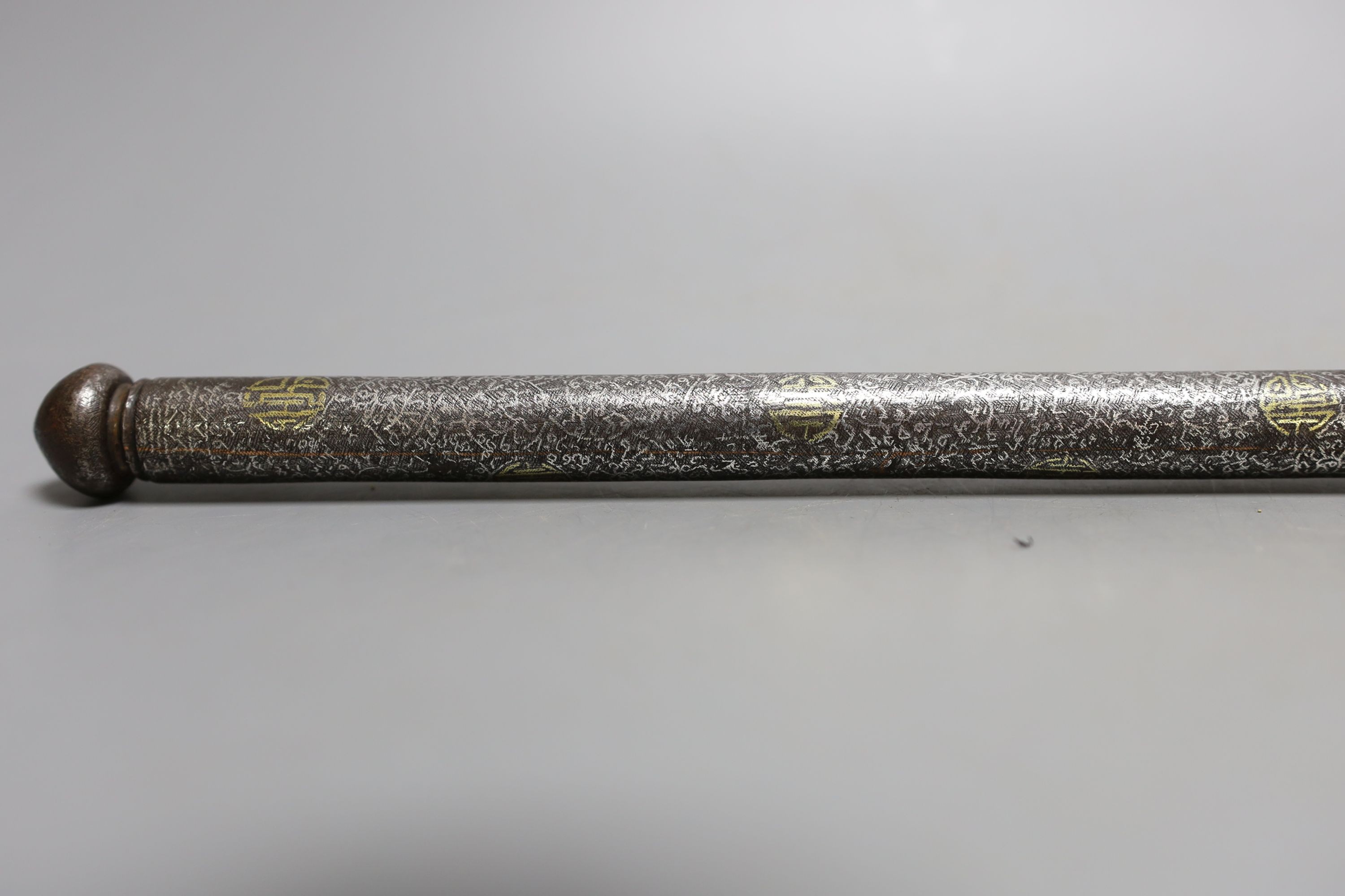 An 18th century Tibetan silver and gold damascened iron pen case, 31.5 cms long.